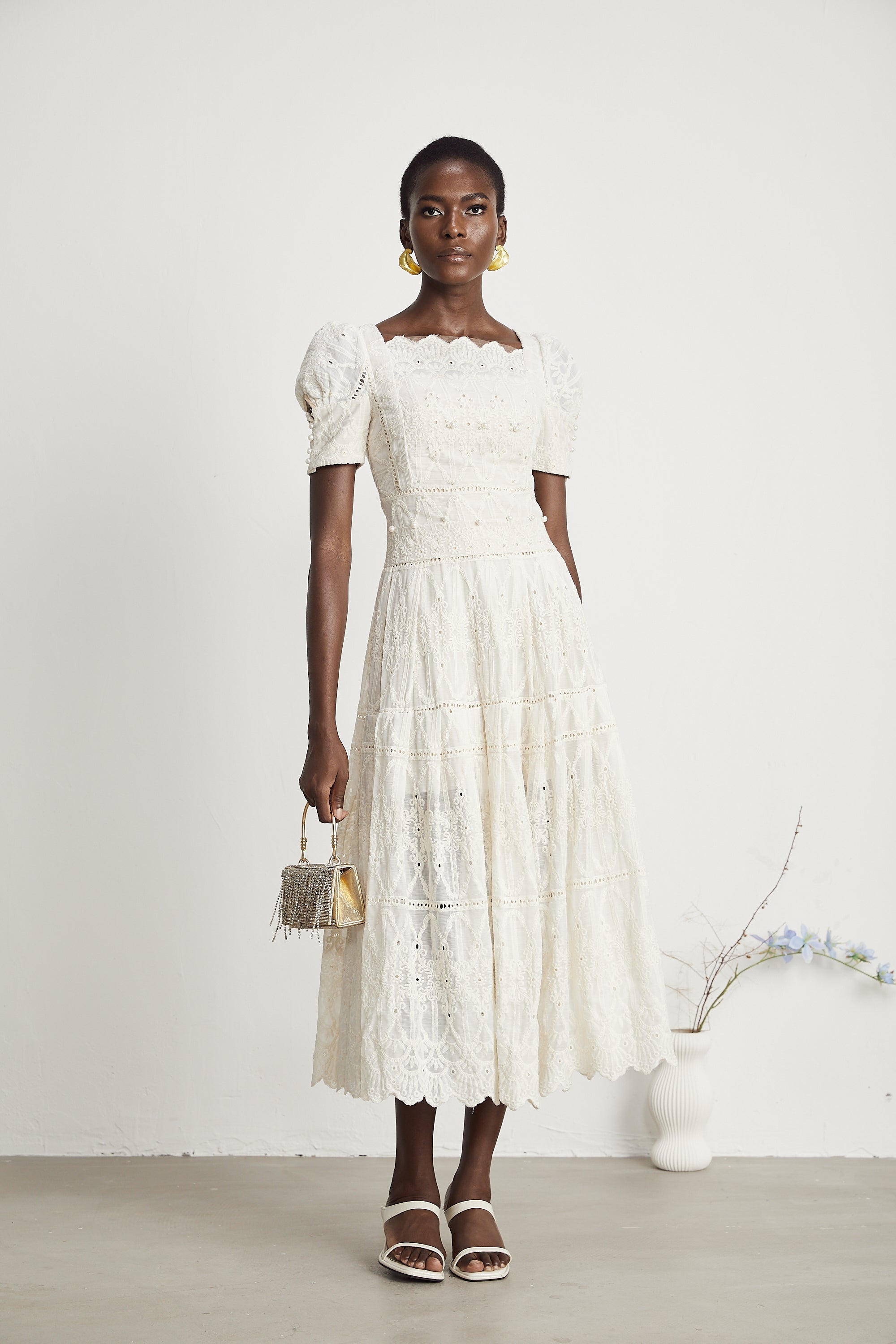 <img src="https://www.beryn-boutique.com/" 
       alt="Elegant White Lace Midi Dress for Work" 
       loading="lazy" />