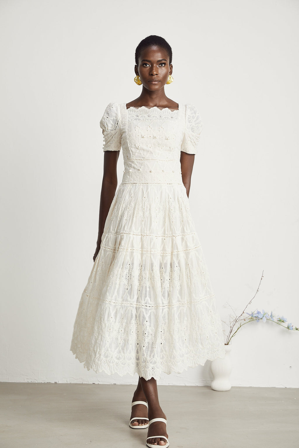 <img src="https://www.beryn-boutique.com/" 
       alt="Elegant White Lace Midi Dress for Work" 
       loading="lazy" />