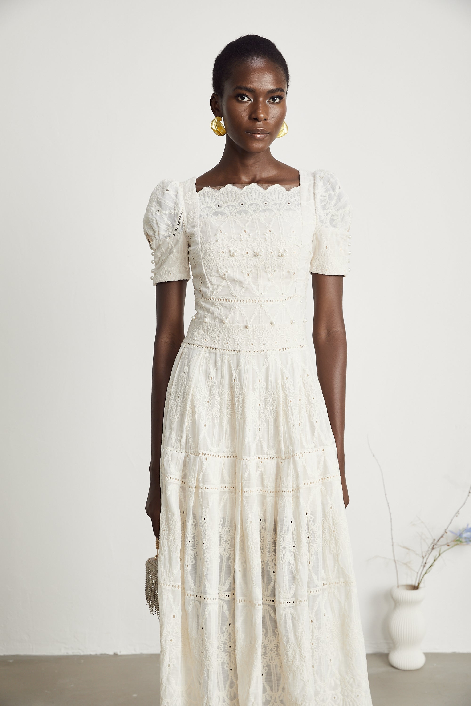 <img src="https://www.beryn-boutique.com/" 
       alt="Elegant White Lace Midi Dress for Work" 
       loading="lazy" />