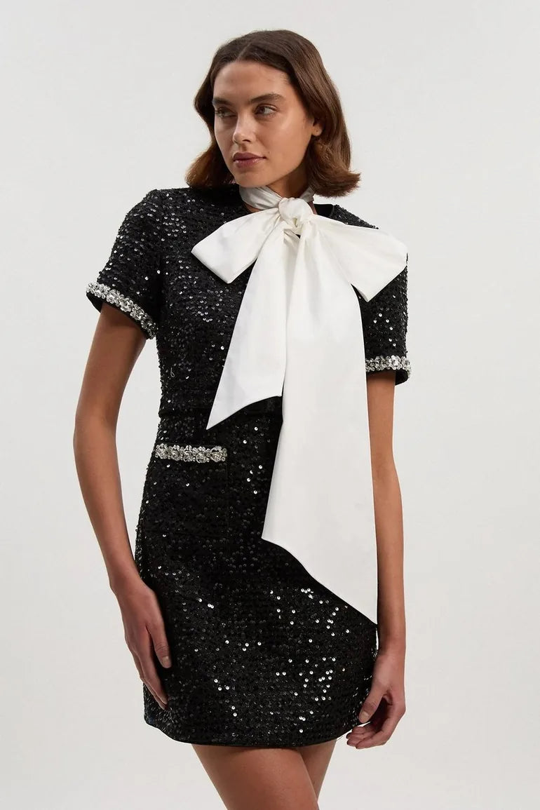 <a href="https://beryn-boutique.com/dress">
<img src="xxx.jpg" alt=<"Bow Tie Neck Sequin Tweed Dress Luxury Formal Mini Dress for Women">
</a>
